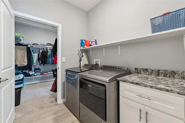 a utility room with dryer and washer