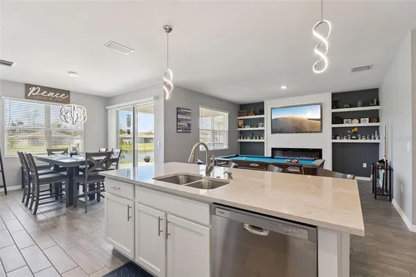 a kitchen with a table chairs and microwave
