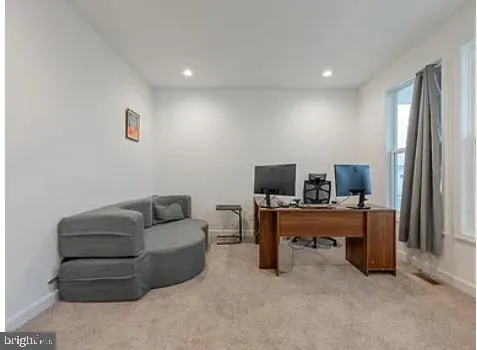 a kitchen with stainless steel appliances granite countertop a sink a stove cabinets and wooden floor