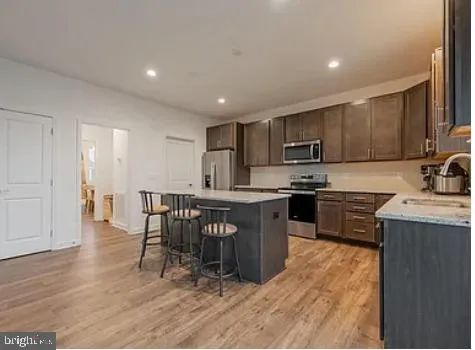 a living room with furniture window and wooden floor