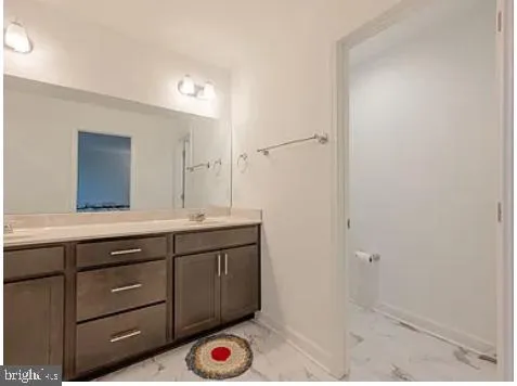 an aerial view of a house with a garden and lake view