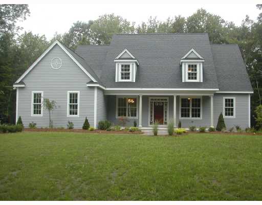 489 Fletcher Road North Kingstown, RI 02852 - Photo 1 of 8 Exterior Front. Front View of the Home Painted Gray with White Trim and Maroon Door.