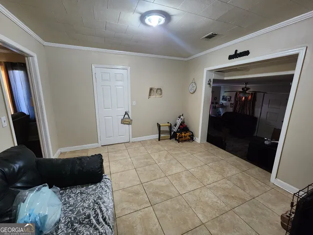 a bedroom with a bed and a mirror