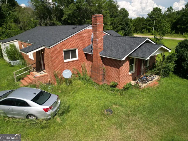 a aerial view of a house with a yard