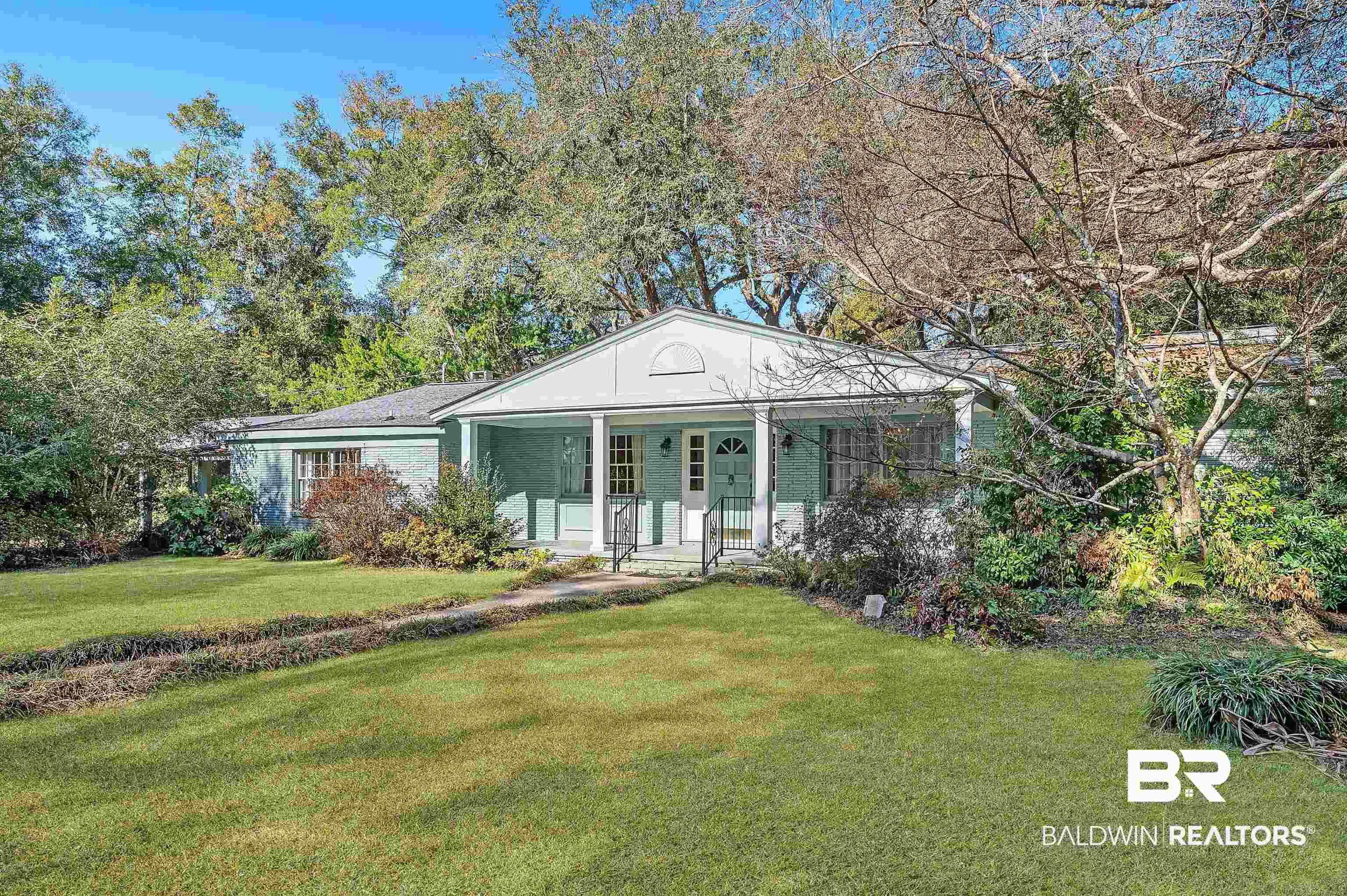 14375 Oak Street Magnolia Springs, AL 36555 - Photo 1 of 20 View of front facade featuring a front lawn and a porch