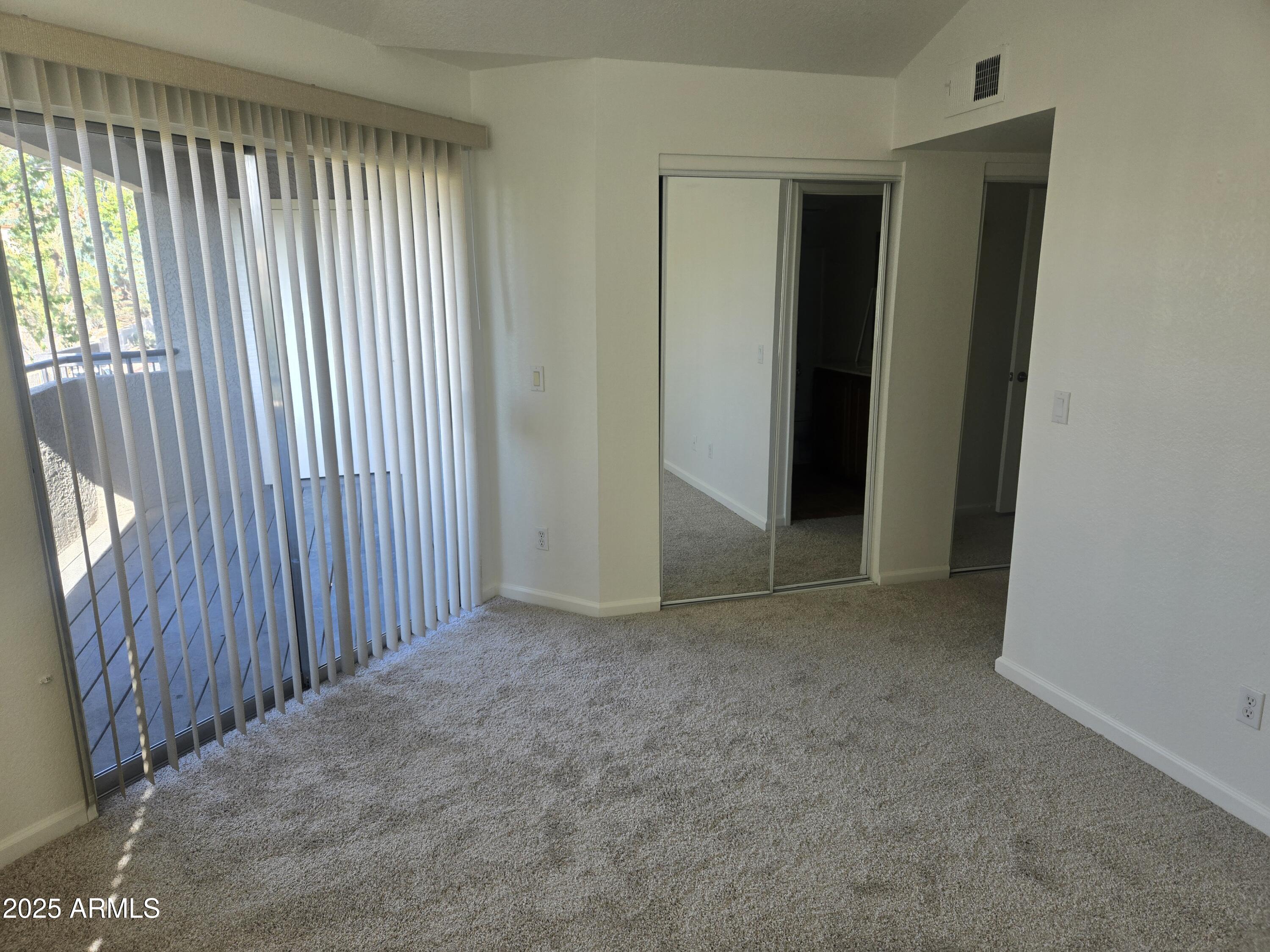 1720 East Thunderbird Road, Unit 2094 Phoenix, AZ 85022 - Photo 12 of 36 an empty room with windows