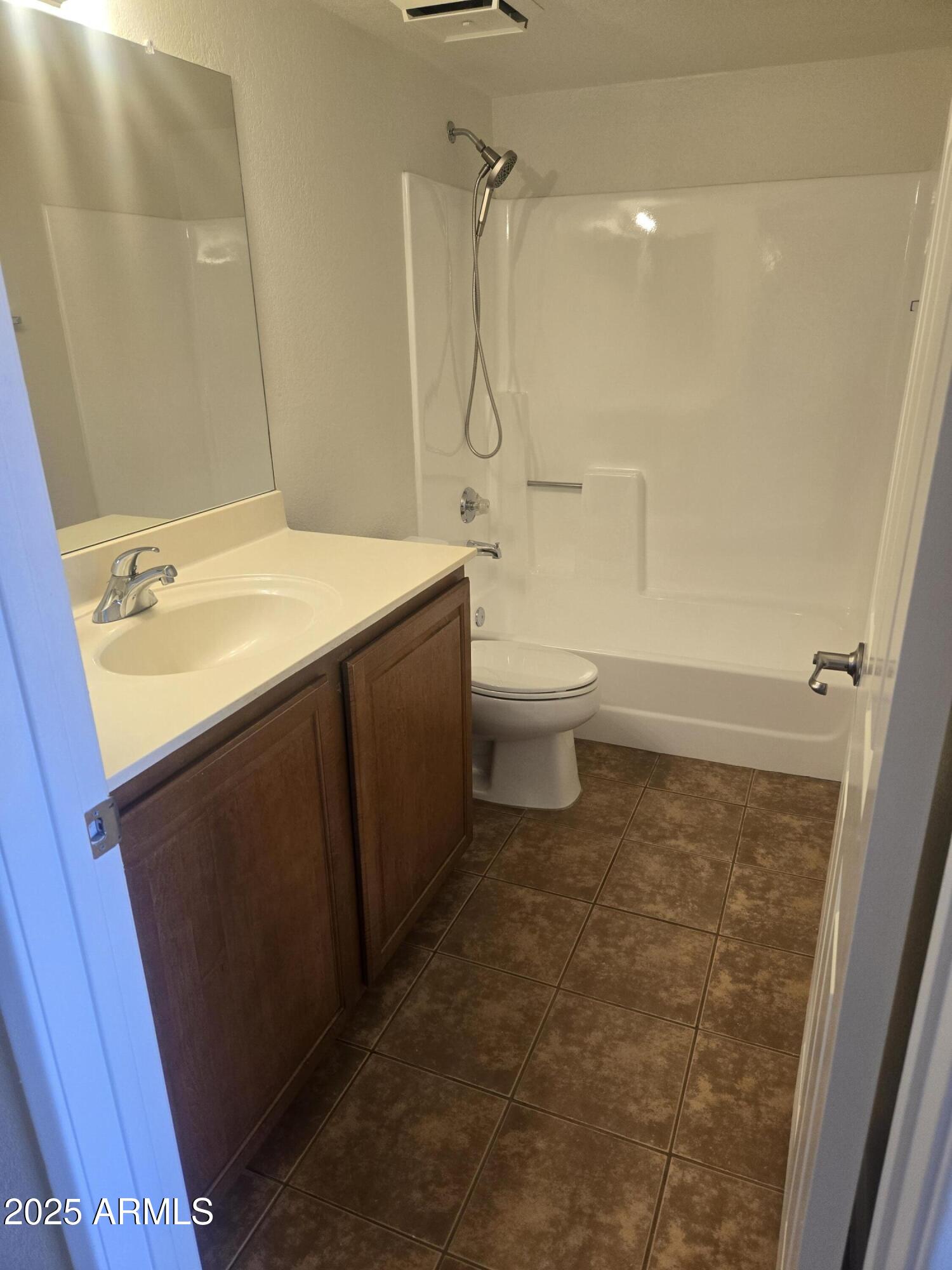 1720 East Thunderbird Road, Unit 2094 Phoenix, AZ 85022 - Photo 13 of 36 a bathroom with a sink toilet and shower