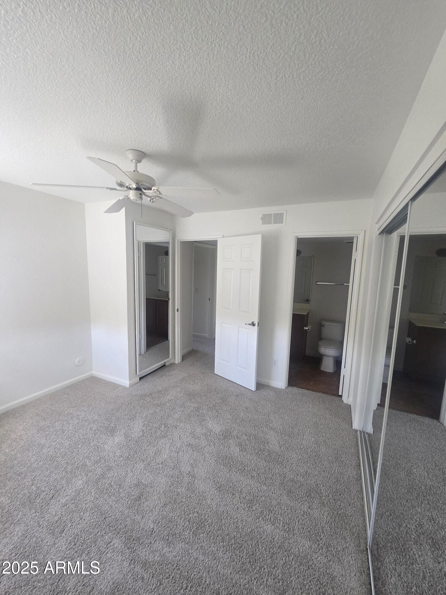 1720 East Thunderbird Road, Unit 2094 Phoenix, AZ 85022 - Photo 17 of 36 a view of a big room with closet and chandelier fan