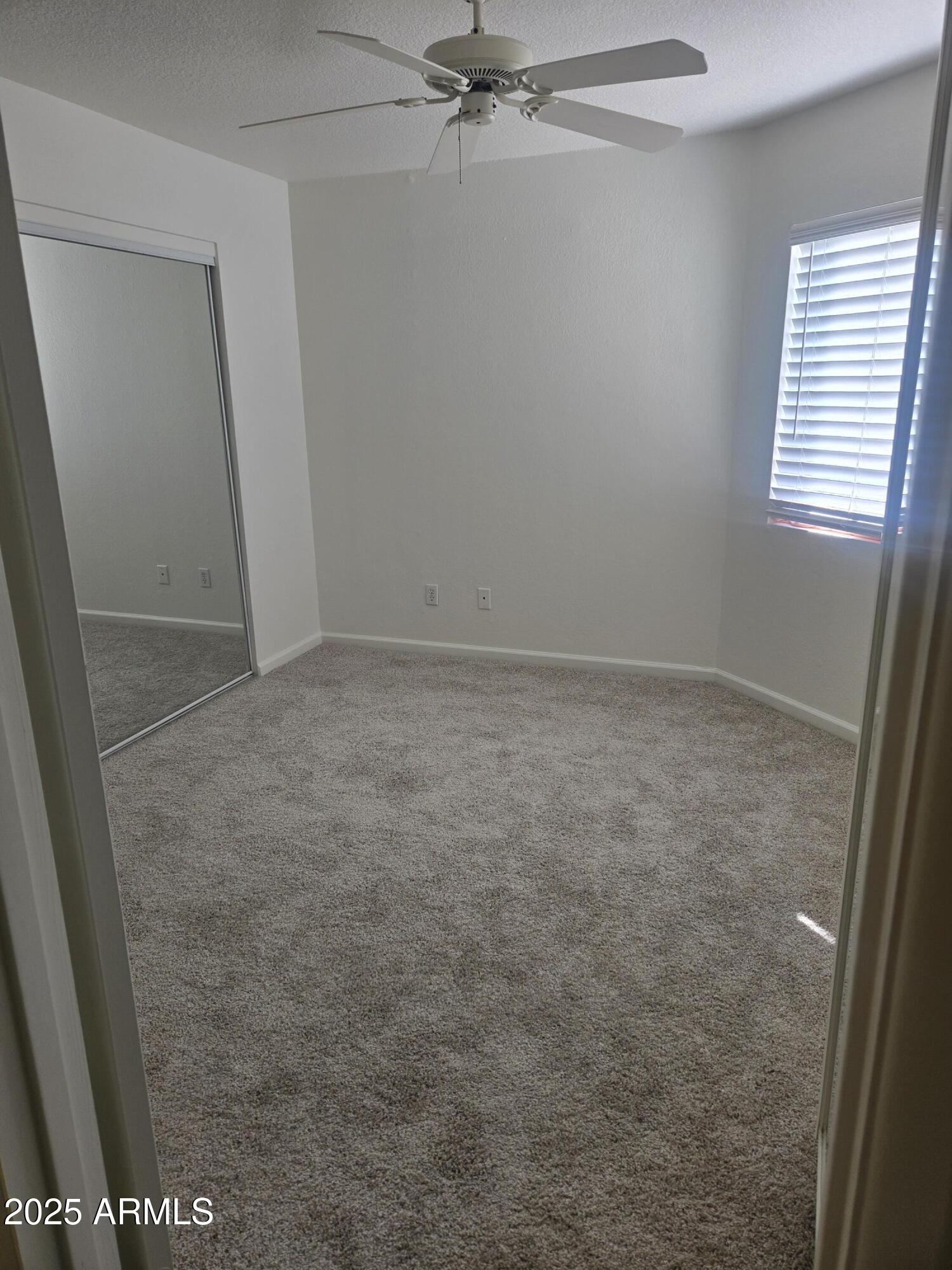 1720 East Thunderbird Road, Unit 2094 Phoenix, AZ 85022 - Photo 18 of 36 an empty room with a window