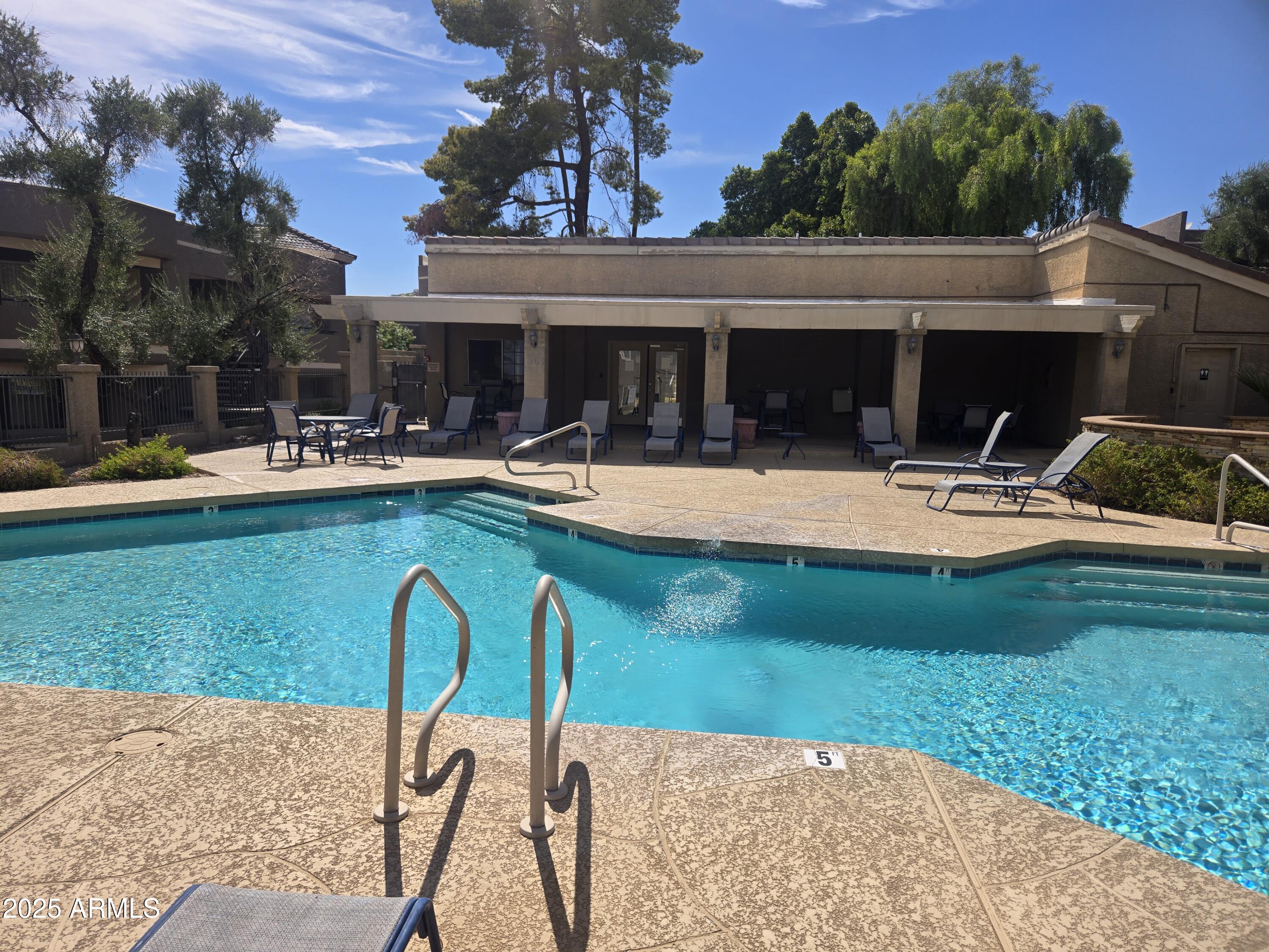 1720 East Thunderbird Road, Unit 2094 Phoenix, AZ 85022 - Photo 32 of 36 a house view with swimming pool and garden space