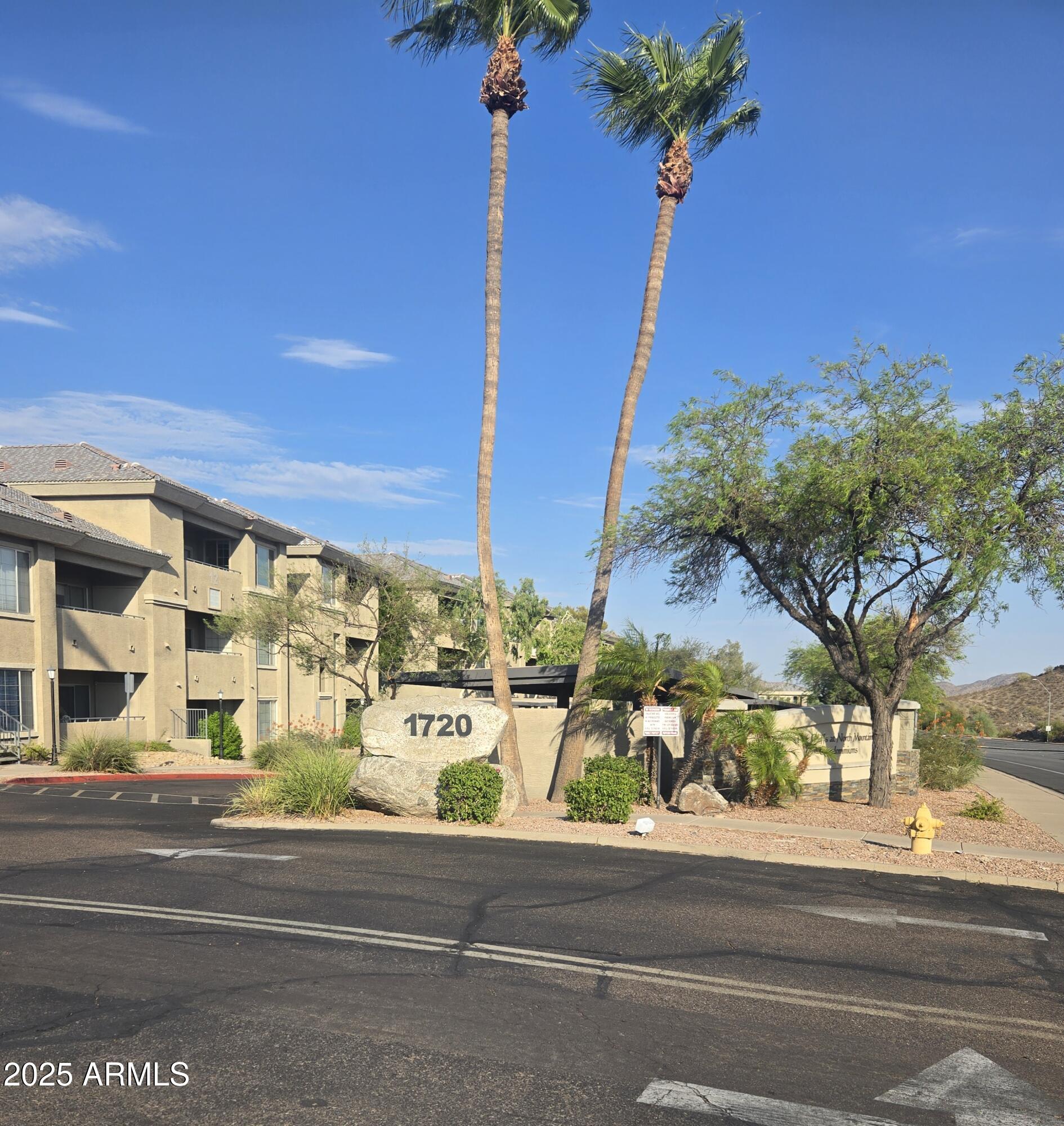 1720 East Thunderbird Road, Unit 2094 Phoenix, AZ 85022 - Photo 35 of 36 a view of a street with a building in the background
