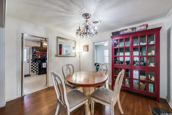 a view of a dining room with furniture and wooden floor