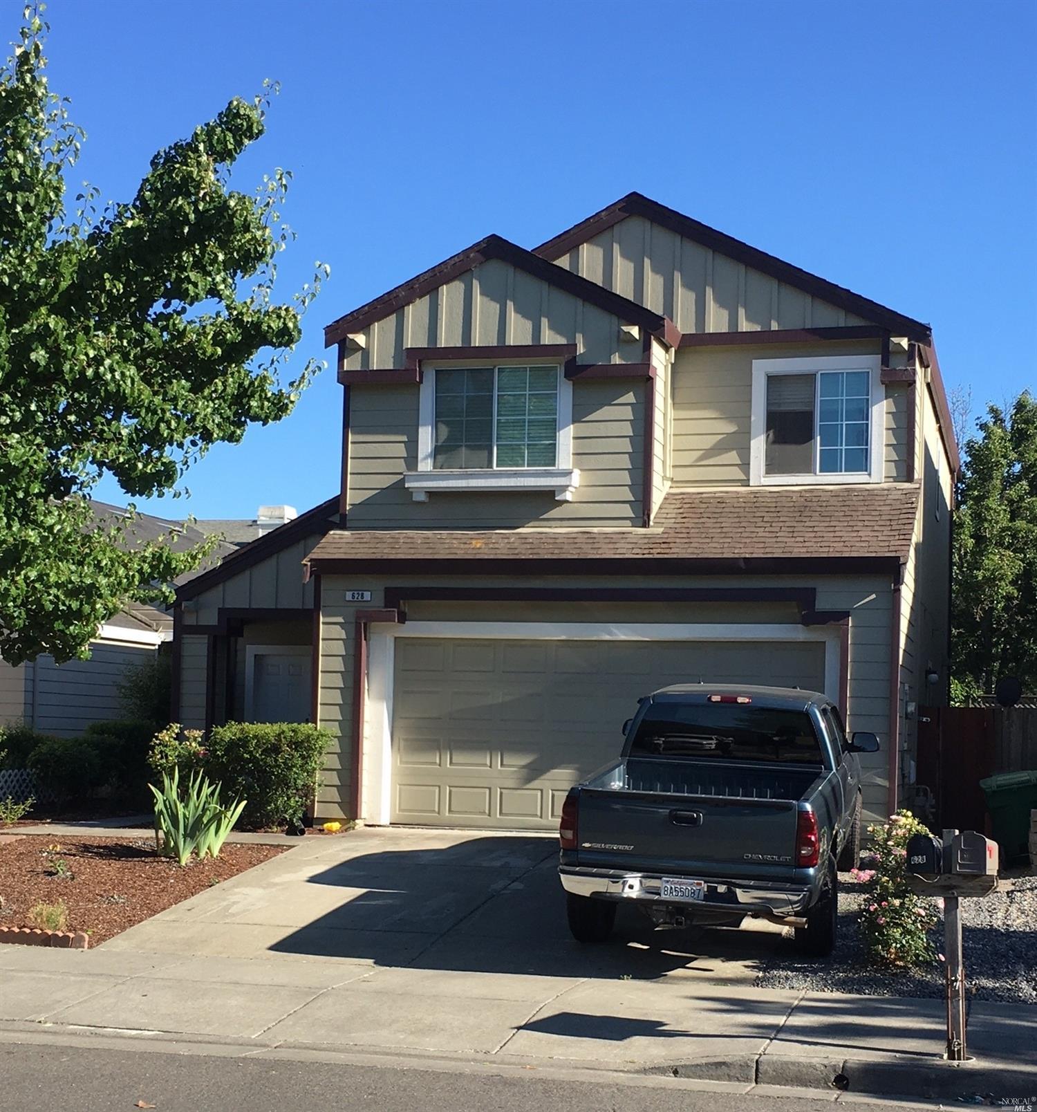 628 Powderhorn Avenue Santa Rosa, CA 95407 - Photo 1 of 1 a front view of a house with a garden