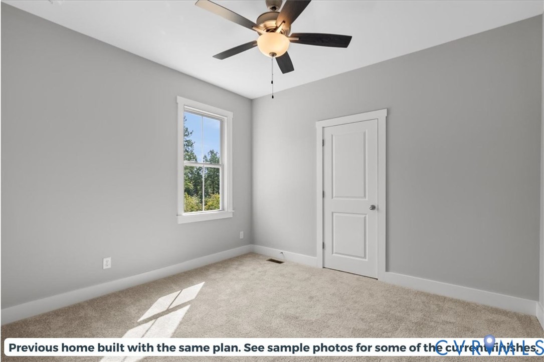 5386 Mountain Creek Road Green Bay, VA 23942 - Photo 21 of 27 a view of a livingroom with a window and a ceiling fan