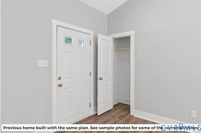 a large white kitchen with cabinets