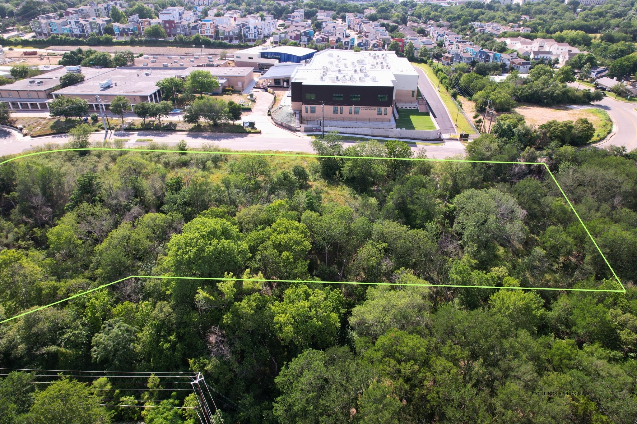 2813-2827 Metcalfe Road Austin, TX 78741 - Photo 12 of 13 A spacious, tree-lined lot awaits new development opportunities, nestled near vibrant community. Minutes from South Congress, Austin.