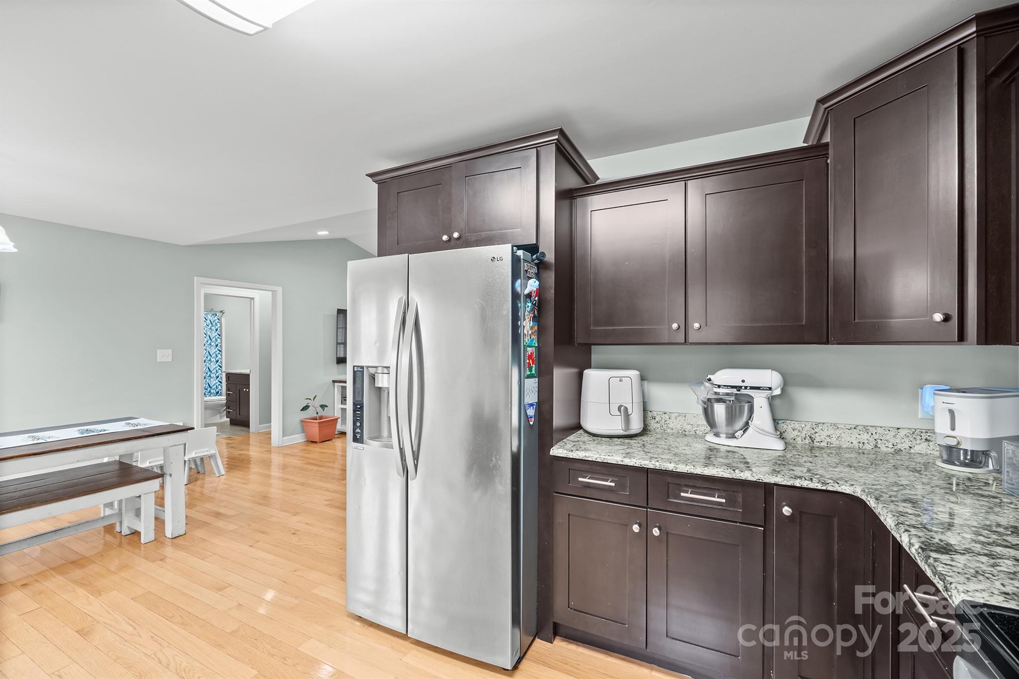 2572 Rock Dam Road Lincolnton, NC 28092 - Photo 19 of 30 a kitchen with stainless steel appliances granite countertop a refrigerator and a sink