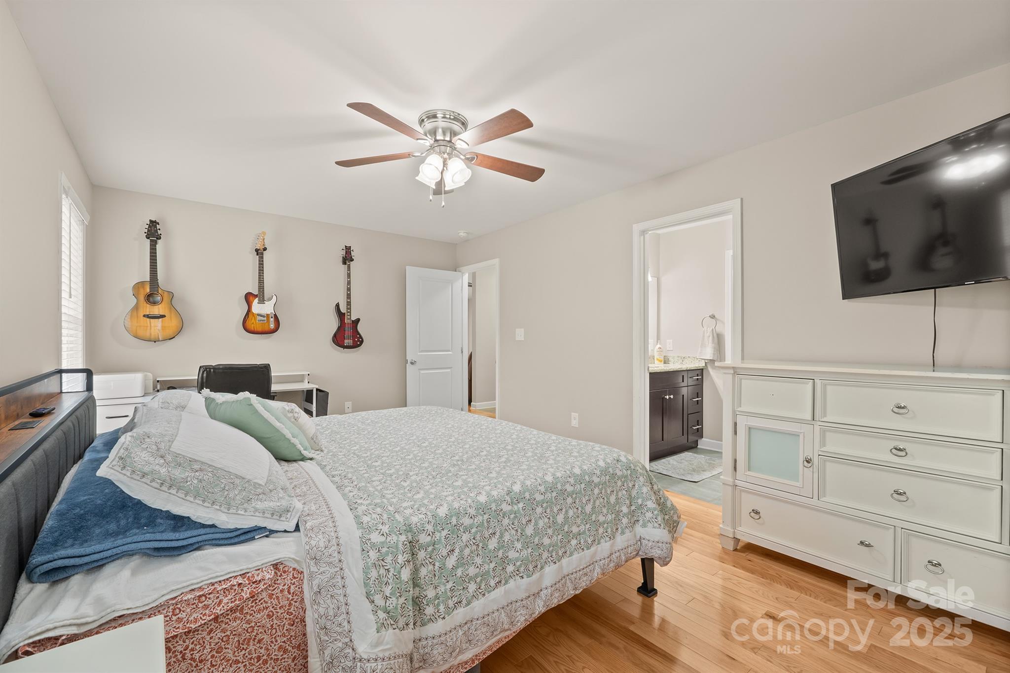 2572 Rock Dam Road Lincolnton, NC 28092 - Photo 26 of 30 a bedroom with a bed and a flat screen tv