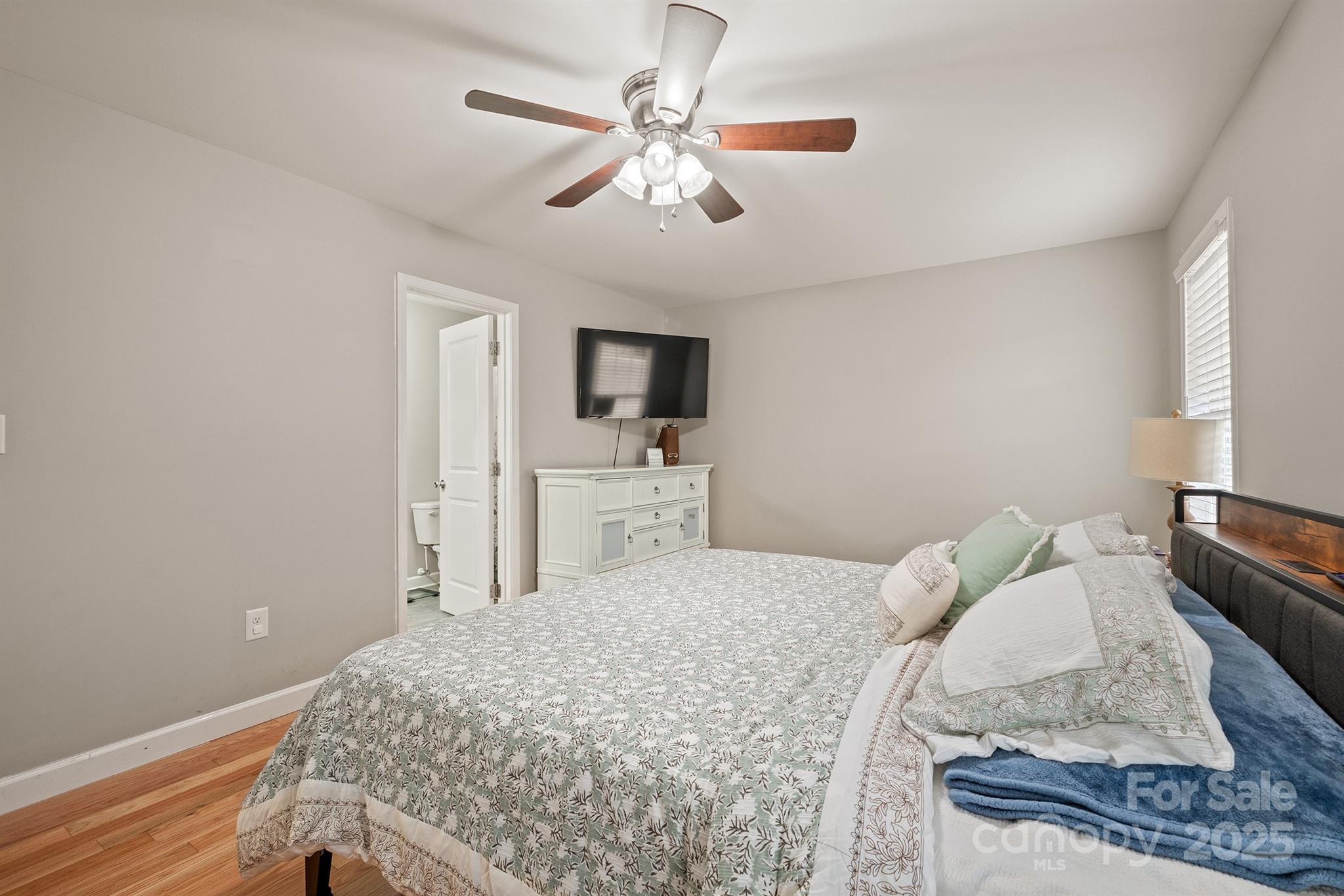 2572 Rock Dam Road Lincolnton, NC 28092 - Photo 27 of 30 a bedroom with a bed and a couch