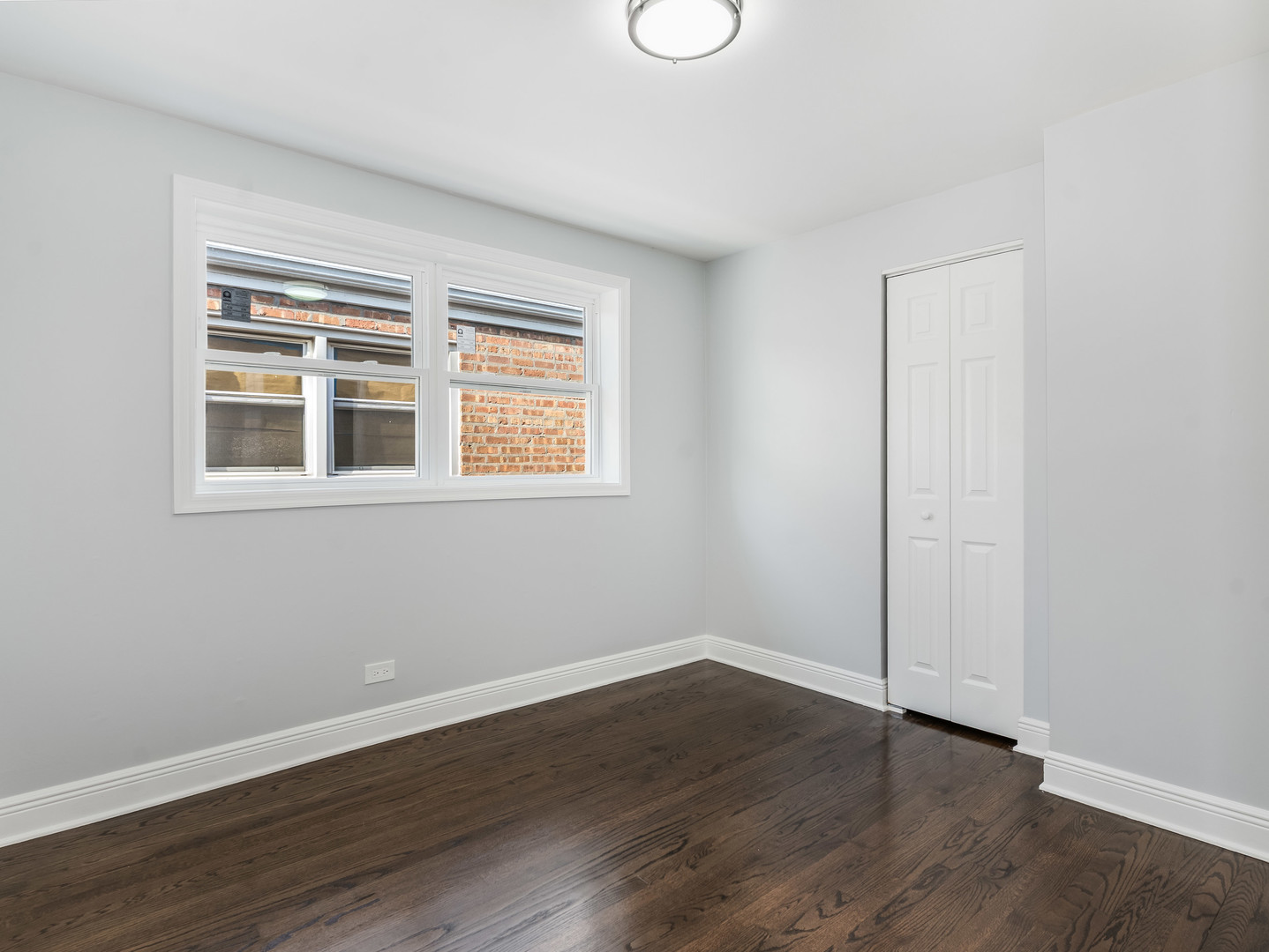 7502 64th Street Summit, IL 60501 - Photo 14 of 31 a view of a room with wooden floor and windows