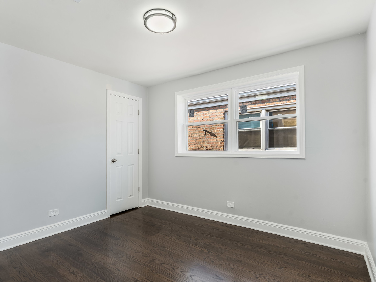 7502 64th Street Summit, IL 60501 - Photo 15 of 31 a view of empty room with wooden floor and fan