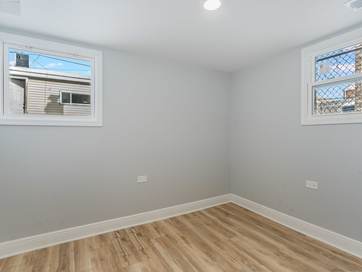 7502 64th Street Summit, IL 60501 - Photo 28 of 31 a view of an empty room with wooden floor and a window