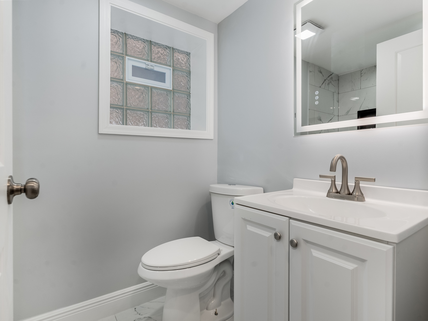 7502 64th Street Summit, IL 60501 - Photo 29 of 31 a bathroom with a sink and a toilet