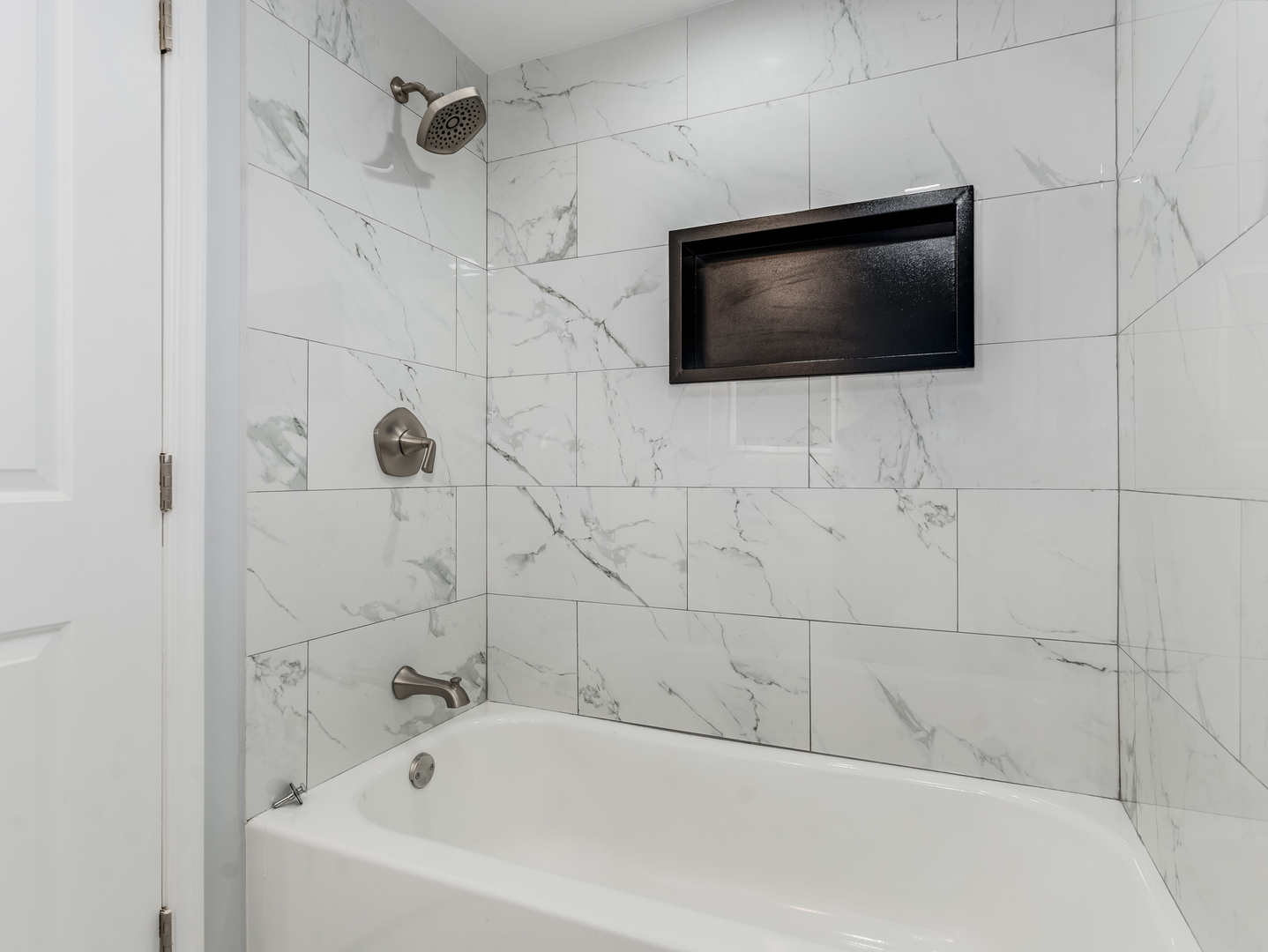 7502 64th Street Summit, IL 60501 - Photo 30 of 31 a bathroom with a bathtub and a flat screen tv