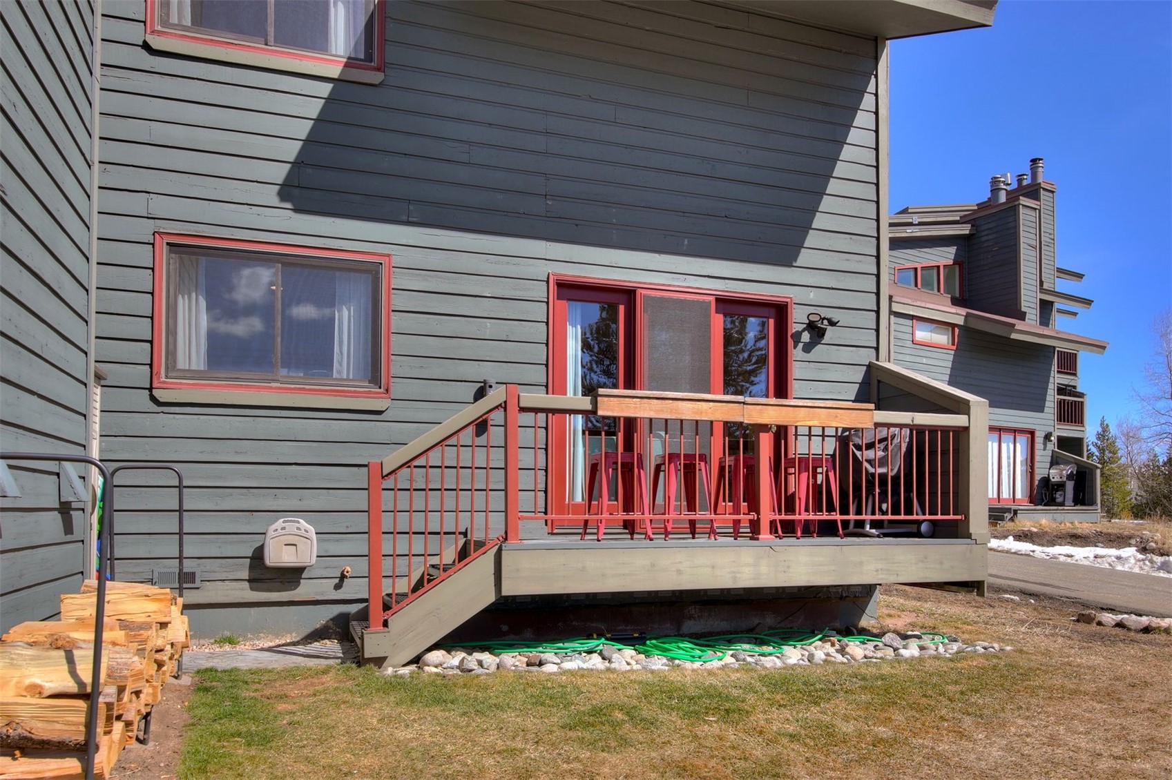 9460 Ryan Gulch Road, Unit 9460 Silverthorne, CO 80498 - Photo 33 of 39 a front view of a house with a yard
