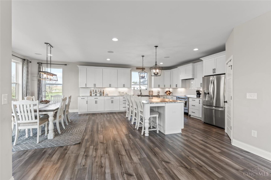 2425 Middleboro Road Clarksville, OH 45113 - Photo 35 of 91 This spacious, light-filled kitchen with a central island offers an inviting gathering space for all.