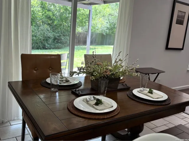 a view of a dining room with furniture window and outdoor view