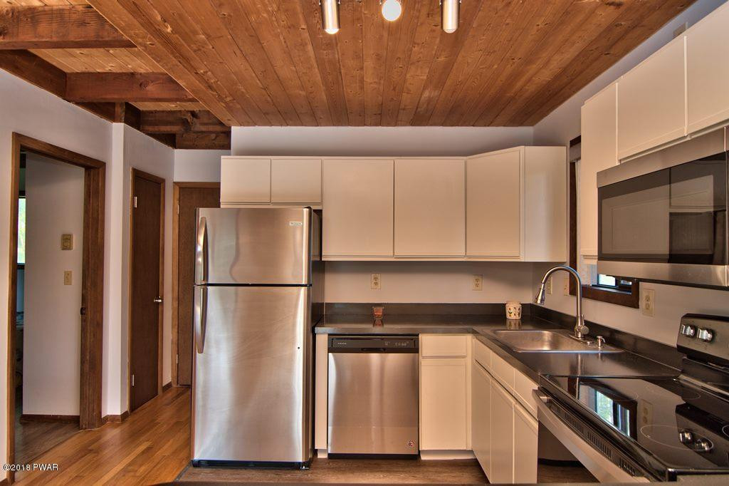 2412 Crest View Road Lake Ariel, PA 18436 - Photo 15 of 50 a kitchen with stainless steel appliances a refrigerator sink and cabinets