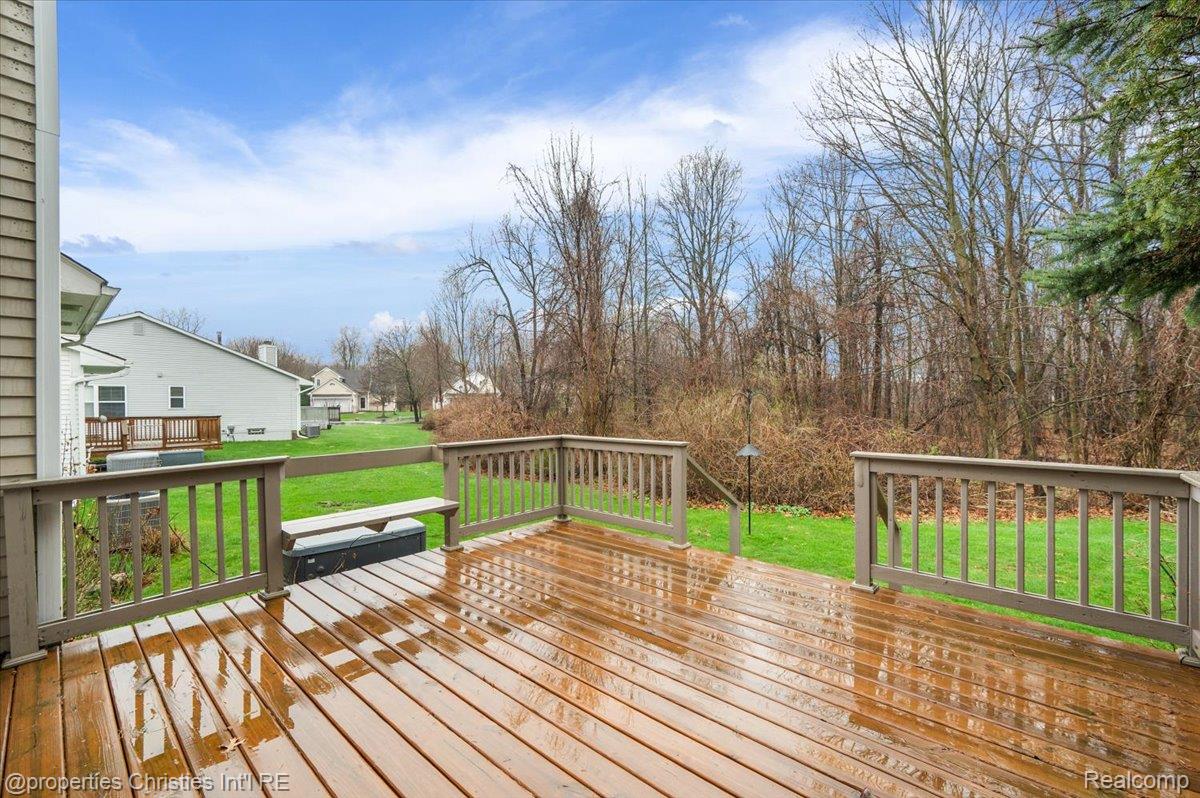 955 Rikki Ann Court Wixom, MI 48393 - Photo 19 of 54 Wooden deck featuring a yard