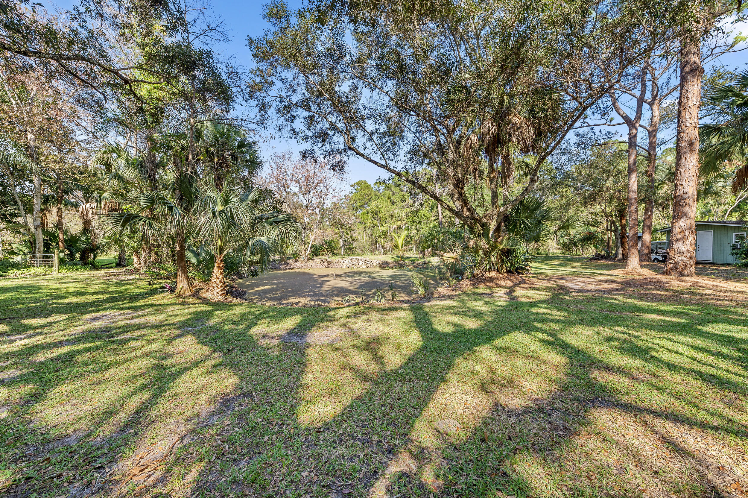 9207 166th Way North Jupiter, FL 33478 - Photo 15 of 34 Backyard & Pond