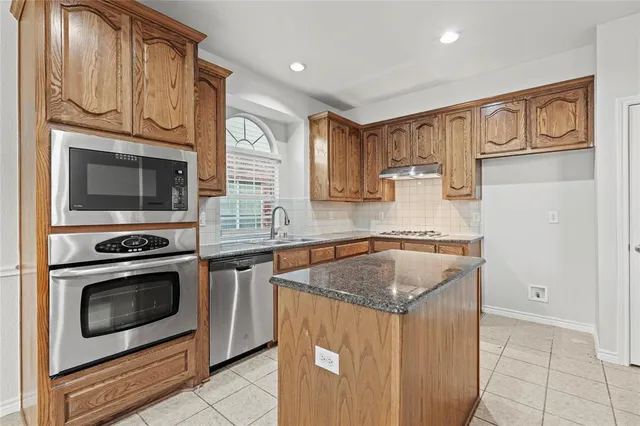 a bathroom with a sink a mirror and shower view