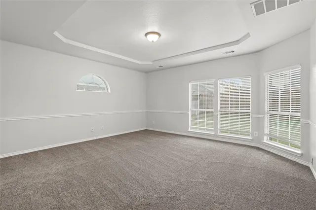 a spacious bathroom with a bathtub and a shower