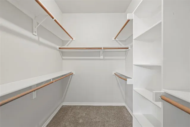 a spacious bathroom with a sink and a mirror