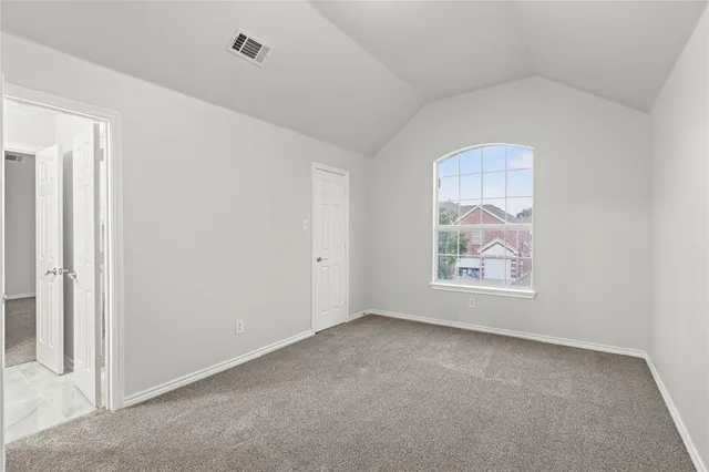 a view of empty room with windows