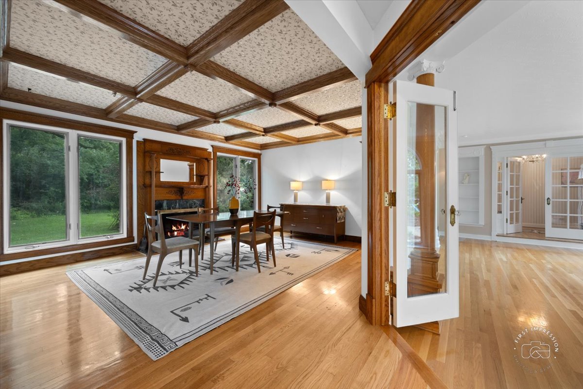27158 West Cuba Road Barrington, IL 60010 - Photo 12 of 51 a dining room with furniture and a floor to ceiling window