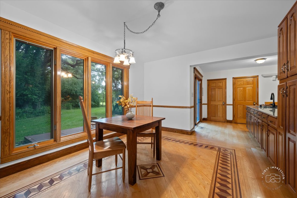 27158 West Cuba Road Barrington, IL 60010 - Photo 18 of 51 a view of a dining room with furniture window and wooden floor