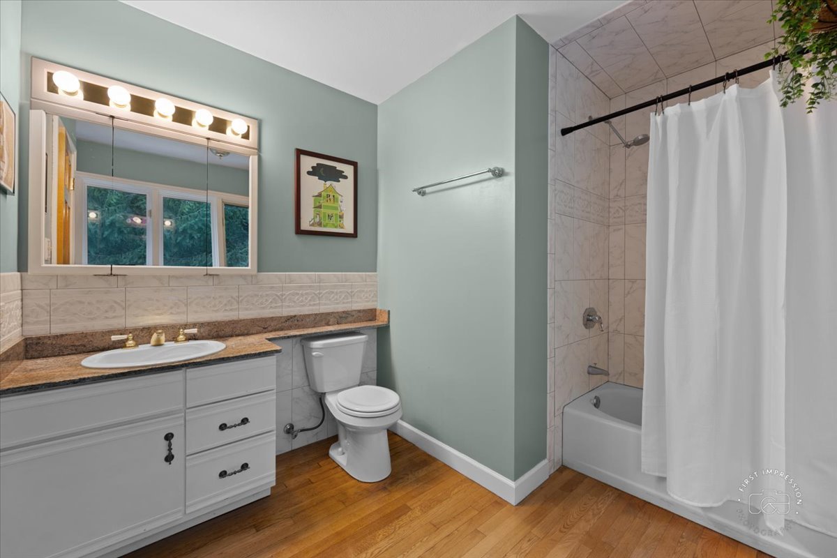 27158 West Cuba Road Barrington, IL 60010 - Photo 19 of 51 a view of bathroom with a toilet sink and mirror