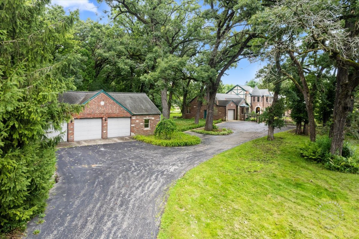 27158 West Cuba Road Barrington, IL 60010 - Photo 2 of 51 a front view of a house with garden