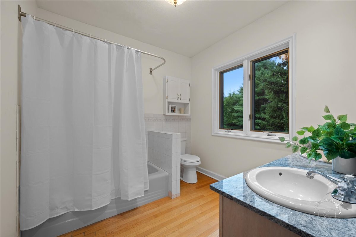 27158 West Cuba Road Barrington, IL 60010 - Photo 22 of 51 a bathroom with a granite countertop sink and a mirror