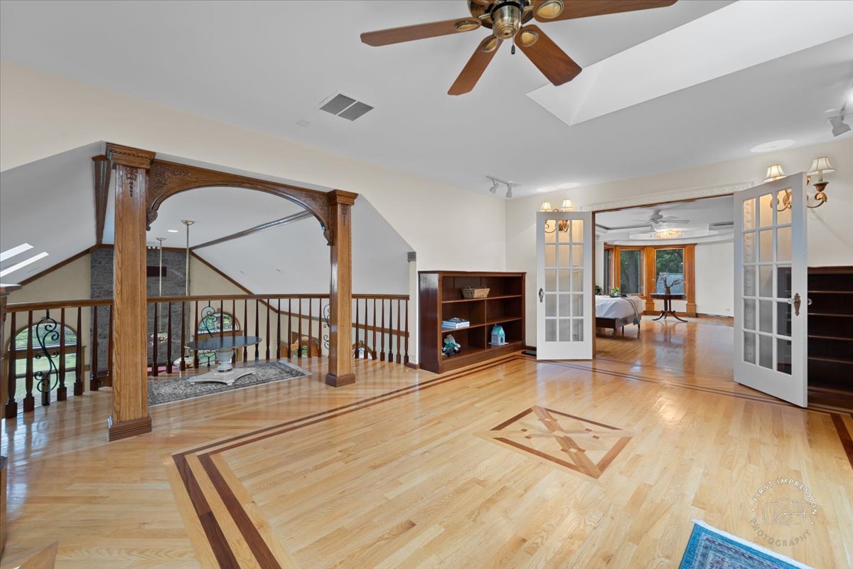 27158 West Cuba Road Barrington, IL 60010 - Photo 25 of 51 a living room with fireplace furniture and a wooden floor