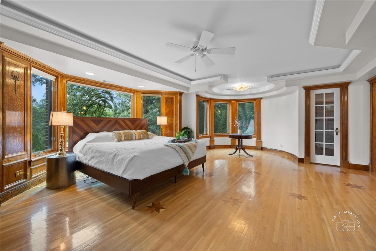 27158 West Cuba Road Barrington, IL 60010 - Photo 27 of 51 a bed room with a bed and large windows