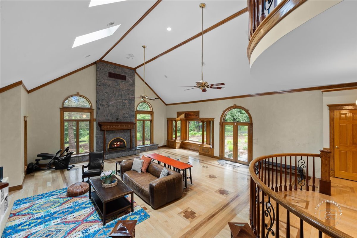 27158 West Cuba Road Barrington, IL 60010 - Photo 34 of 51 a living room with fireplace furniture and a chandelier