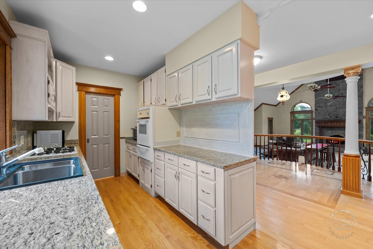 27158 West Cuba Road Barrington, IL 60010 - Photo 41 of 51 a kitchen with granite countertop a sink and cabinets