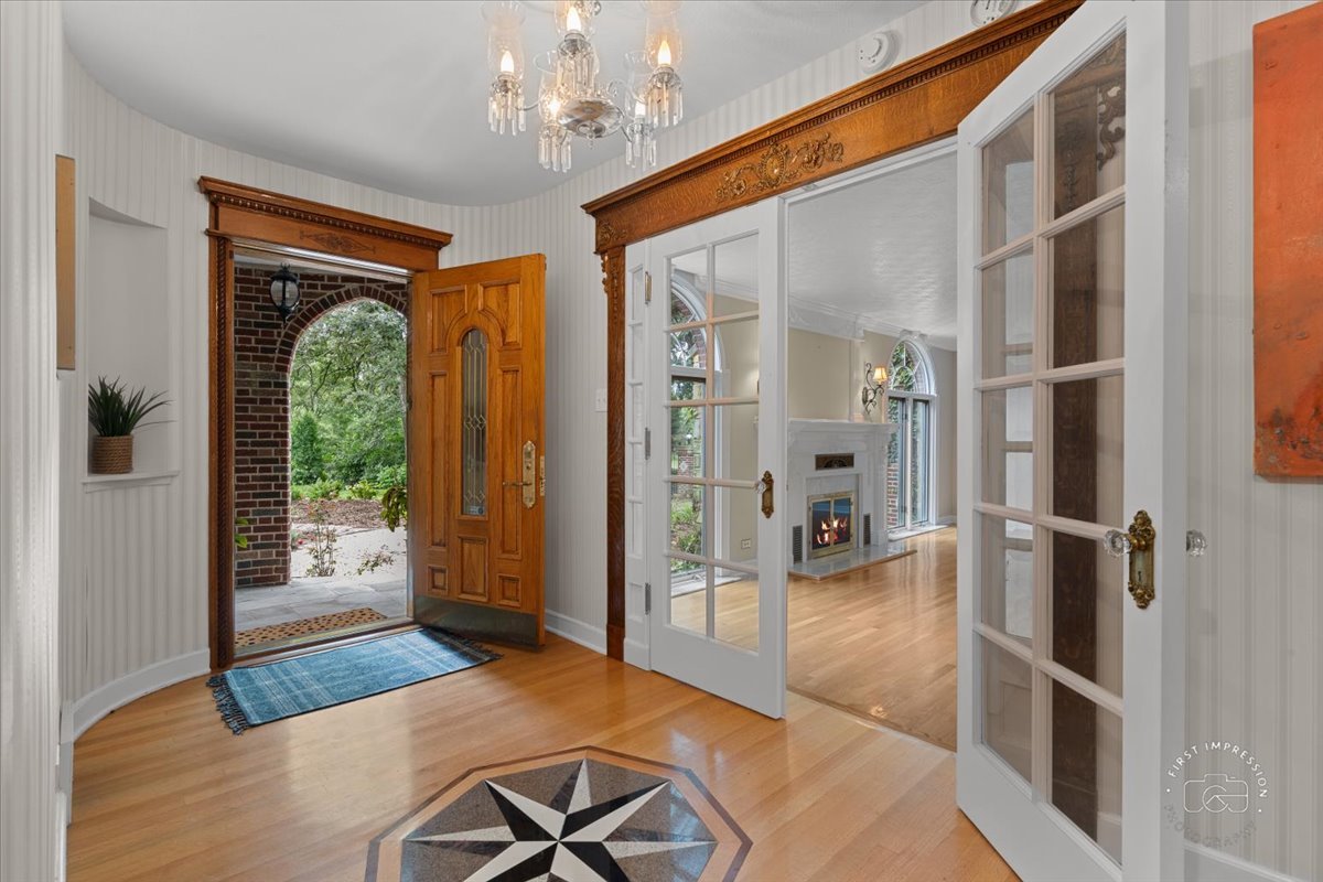 27158 West Cuba Road Barrington, IL 60010 - Photo 6 of 51 a view of a hallway with wooden floor and windows