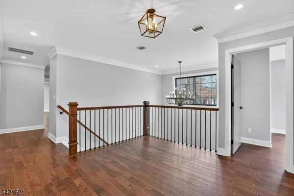 a room with a window and wooden floor