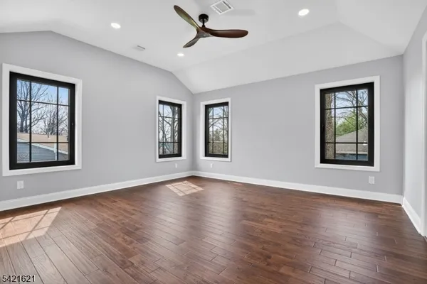 a view of a storage and utility room in wooden floor